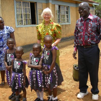 Nangina Head Teacher with pupils